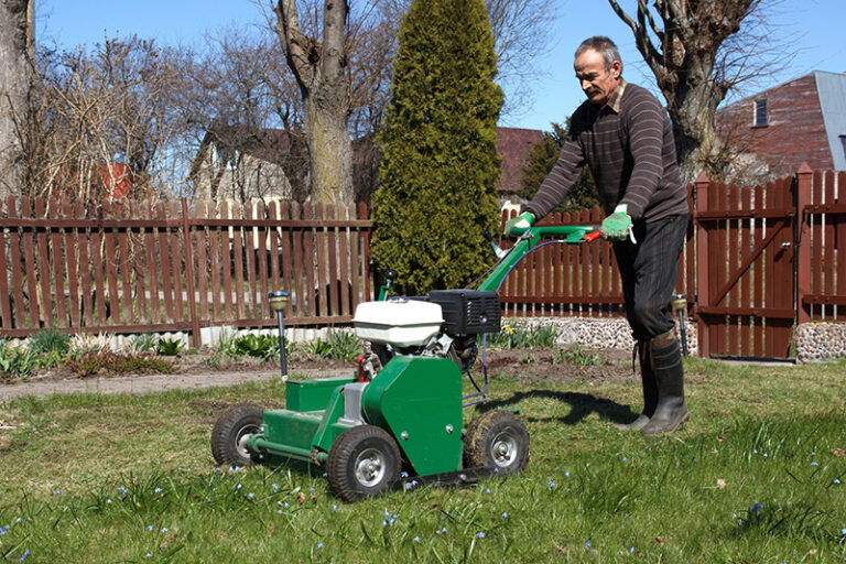 Man working with Lawn Aerator